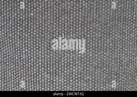 Gray woven or knit fabric texture surface. Top view, macro shot, no people. Stock Photo