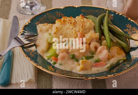 Traditional fish pie with runner beans. Stock Photo