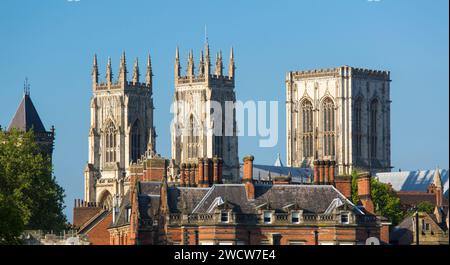 York, North Yorkshire, England. Panoramic view across city rooftops to the majestic medieval towers of York Minster. Stock Photo