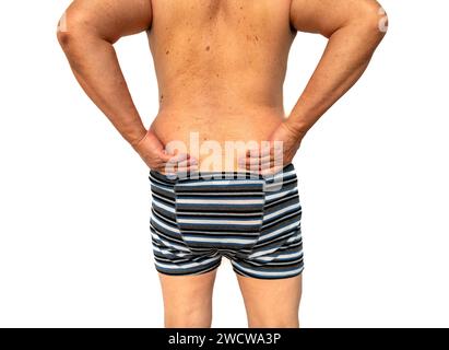 A full back view of a person suffering from back pain isolated in white. Stock Photo