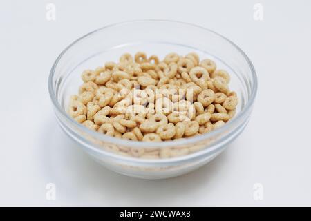 Loops cereals served in glass bowl on white background Stock Photo