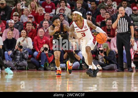 January 16, 2024: El Ellis #3 Arkansas guard works against Texas A&M defender Wade Taylor IV #4. Arkansas defeated Texas A & M 78-77 in Fayetteville, AR. Richey Miller/CSM Stock Photo