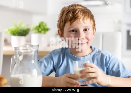 Portrait of a little boy who drank milk and has a mustache from him. Stock Photo