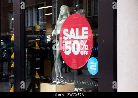 Up to 50% off red sale sign in the window of JD Sports in Exeter, Devon UK Stock Photo