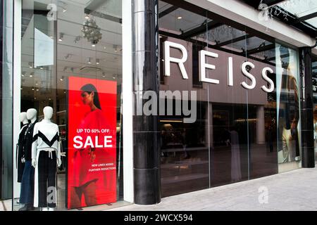 Reiss shop in Princesshay Exeter Devon UK, with up to 60% off red sale sign in the front window Stock Photo