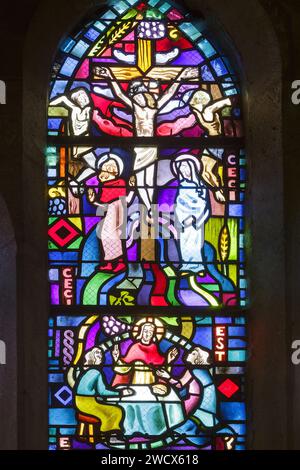 France, Meuse, Vigneulles les Hattonchatel, Saint Maur collegiate church built between the 15th and the 16th century in gothic style, stained glass window of the choir made by master glassmaker from Nancy Jaques Gruber in the 1920's which represents the life of Jesus Stock Photo