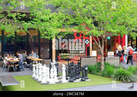 Australia, New South Wales, Sydney, Chippendale district, Central Park Mall shopping center, exterior with a giant chess set in front of cafe terraces Stock Photo
