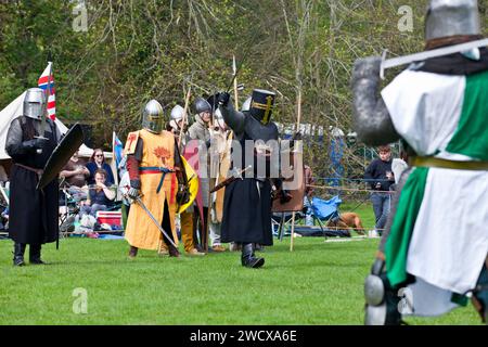 30th April 2023. Hedingham Castle, Suffolk, England.  Sir Mordred and the black knight lead a treacherous assault at Excalibur event.  Re-enactors gather for for a re-telling the story of King Arthur and Excalibur and celebration of all things Arthurian at Hedingham Castle. Stock Photo