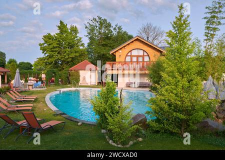 France, Moselle, Conde Northen, Domaine La Grange de Conde, Hotel and Inn Restaurant, the swimming pool and the chalet Reve de Lune Stock Photo