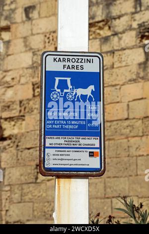 Sign for Karrozzini Fares in Valletta Stock Photo