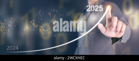 Happy new year 2025. A man draws a rising graph, line, from the end of 2024 rises to the start of 2025. New coming year, journey, of improvement and s Stock Photo