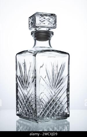 Empty decanter for whiskey on a white background. Stock Photo