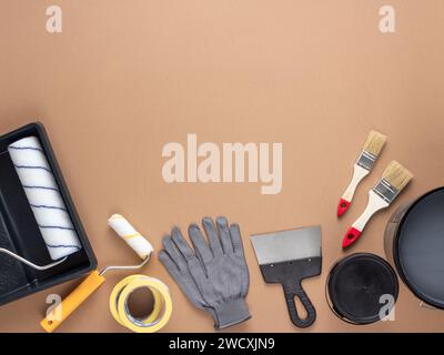 Home improvement painting tools on soft beige background. House or apartment renovation composition with copy space. Stock Photo