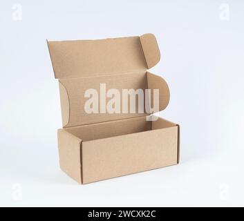 Open empty cardboard box isolated on white. Stock Photo