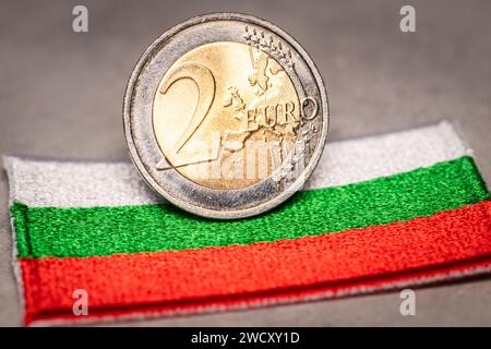 Bulgaria euro, Bulgarians joining the euro zone, Financial concept, Bulgarian flag and 2 euro coin, Currency exchange in the European Union, Adoption Stock Photo