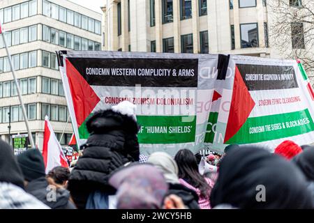 A global day of protests drew thousands of people including Children, who made their way through central London for a pro-Palestinian march, part of a global day of action against the longest and deadliest war between Israel and Palestinians in 75 years. Protesters held up banners, flags and placards as they walked along the embankment by the River Thames in support of Palestinian people in Gaza. London, United Kingdom. Stock Photo