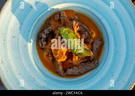 Steak beef kebab with yogurt and garlic served in Skyfire Restaurant Izmir Turkey Stock Photo