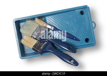 top view of tray with used paint brushes isolated Stock Photo