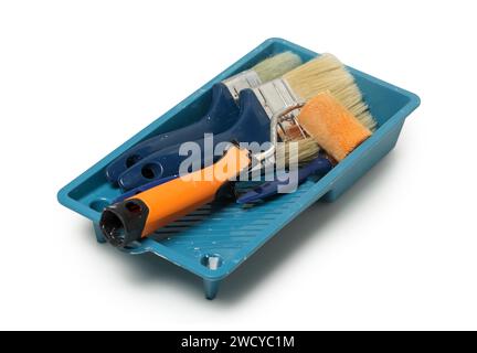tray with used paint brushes and rollers isolated Stock Photo