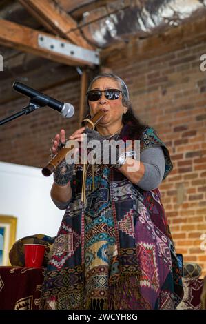 Mignon Geli plays a Native American flute as part of a free public Dr. Martin Luther King, Jr. holiday event held at the General Gomez Arts Crenter Stock Photo
