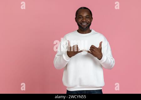 Black man wearing white sweatshirt using sign language Stock Photo