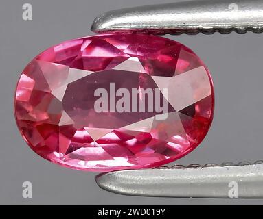 natural pink purple sapphire gem on background Stock Photo
