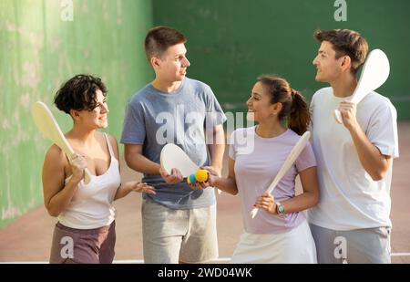 Basque pelota players chatting on outdoor fronton Stock Photo