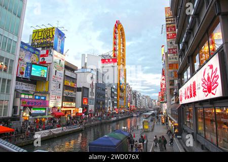 Dotonbori is Osaka's principal tourist and nightlife area famed for its restaurants, shopping, canal and neon signboards. Stock Photo