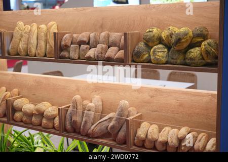 Milan, Italy - January 17, 2024: Fresh bread on shelves in a bakery Stock Photo