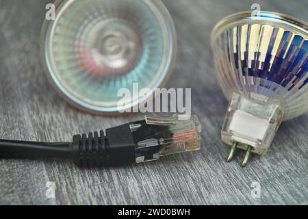 reflector lamps and network cable, symbolic image for Smart Home Stock Photo