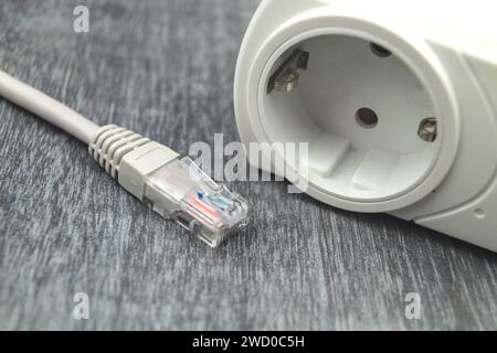 Plug and network plug, symbolic image for smart home Stock Photo