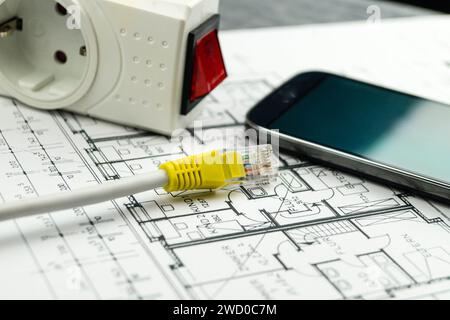 socket outlet adapter with switch, smartphone and network plug on construction drawing, symbolic image for Smart Home Stock Photo