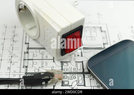 socket outlet adapter with switch, smartphone and network plug on construction drawing, symbolic image for Smart Home Stock Photo