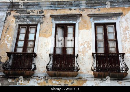 Wood shutter balconies and doors in a two-story 19th century Spanish manor house in the town of Garachico, Tenerife, Canary Islands, Spain. Stock Photo