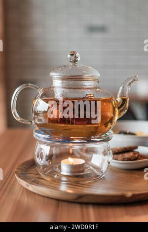 Transparent glass herbal teapot Stock Photo