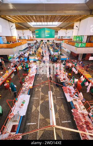 An overview look at the rows of vendors, including many meat butchers. At the main local, Soviet era food market, the Green Bazaar. In Almaty, Kazakhs Stock Photo