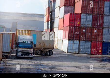 Container trucks and container stacks Stock Photo
