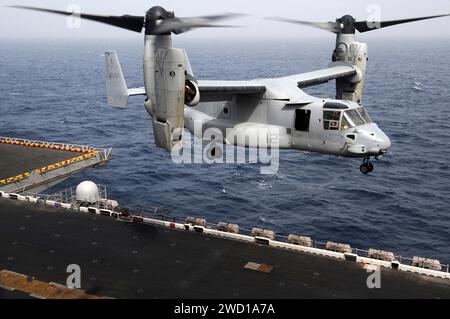 An MV-22B Osprey prepares to land aboard USS Makin Island. Stock Photo