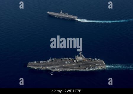 USS Ronald Reagan and the Japan Maritime Self-Defense Force helicopter destroyer JS Izumo. Stock Photo