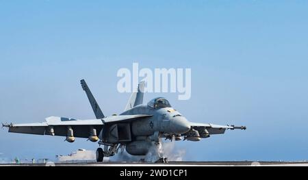 An F/A-18E Super Hornet launches from an aircraft carrier. Stock Photo