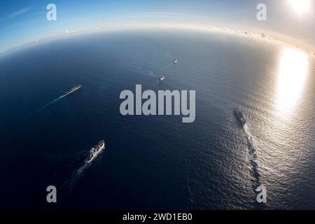 Fleet of military warships transit the Caribbean Sea. Stock Photo