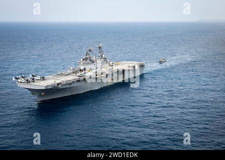 A landing craft, utility enters the well deck of the amphibious assault ...
