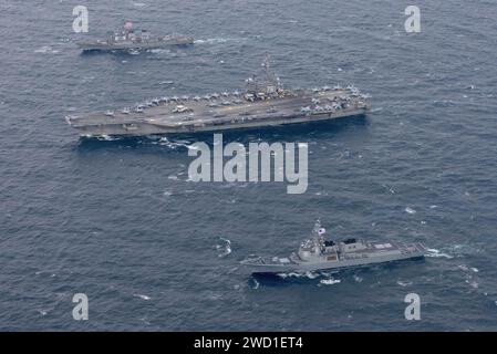 USS Ronald Reagan and USS Stethem steam alongside ships from the Republic of Korea Navy. Stock Photo