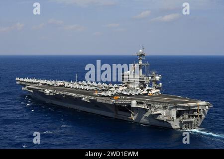 The aircraft carrier USS Theodore Roosevelt transits the Pacific Ocean. Stock Photo