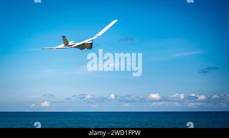An RQ-20 Puma prepares to land during a readiness exercise in Trujillo, Honduras. Stock Photo