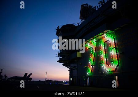 Holiday lights lit up on the Nimitz-class aircraft carrier USS Carl Vinson. Stock Photo