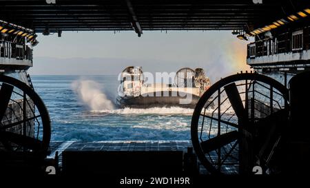 A landing craft air cushion boards the amphibious assault ship USS Essex. Stock Photo