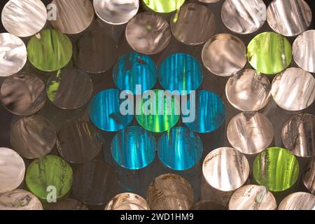 Polished rod ends in silver, lime green and blue are packed in rings at Allegheny Portage Railroad National Historic Site, Pennsylvania. Stock Photo