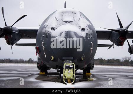 Snow covers an HC-130J Combat King II on the flight line. Stock Photo