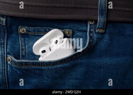 Antalya, Turkey - January 15, 2024: White wireless headphones Apple AirPods 3 Stock Photo